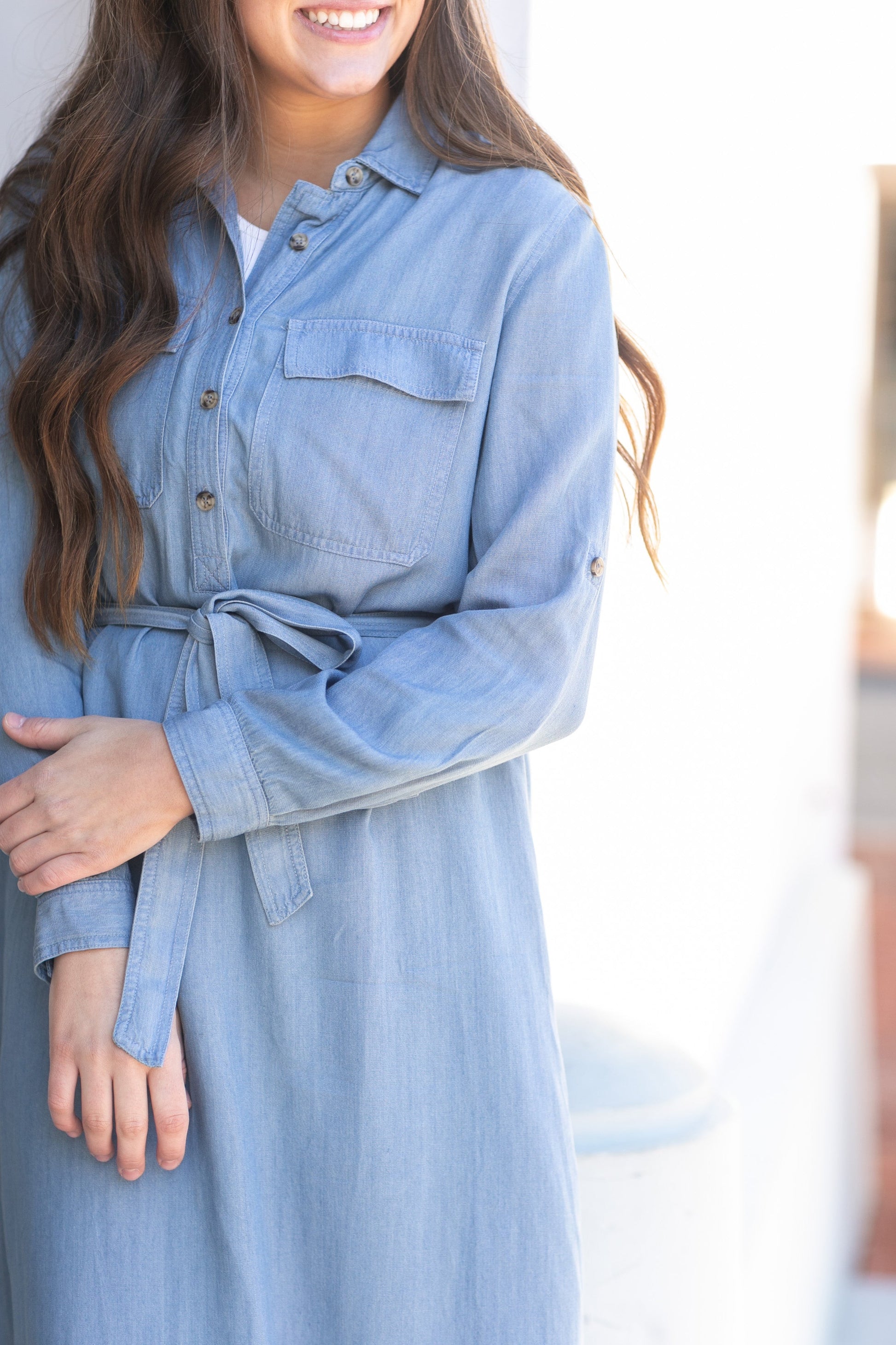 Kimberly Chambray Belted Midi Shirt Dress Dresses is blue with a belt, and half button bodice.