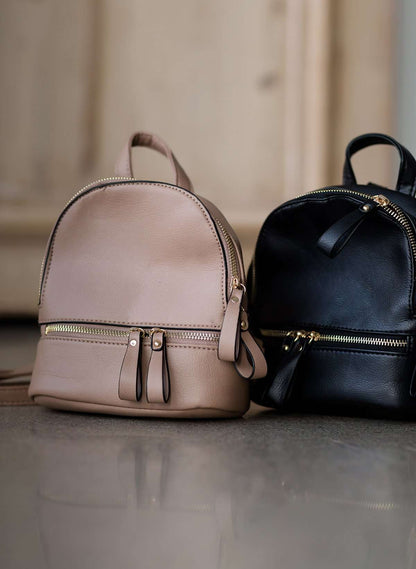 black or taupe small leather backpack purse.