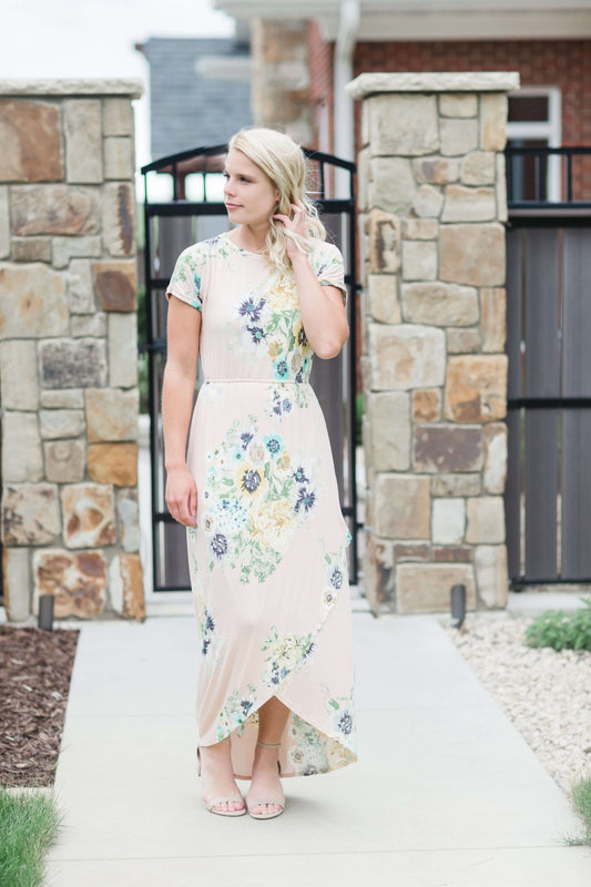 maxi length floral dress with elastic waist that comes in blush, mint or navy florals.