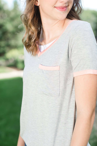 Modest grey v-neck t-shirt with coral hems.