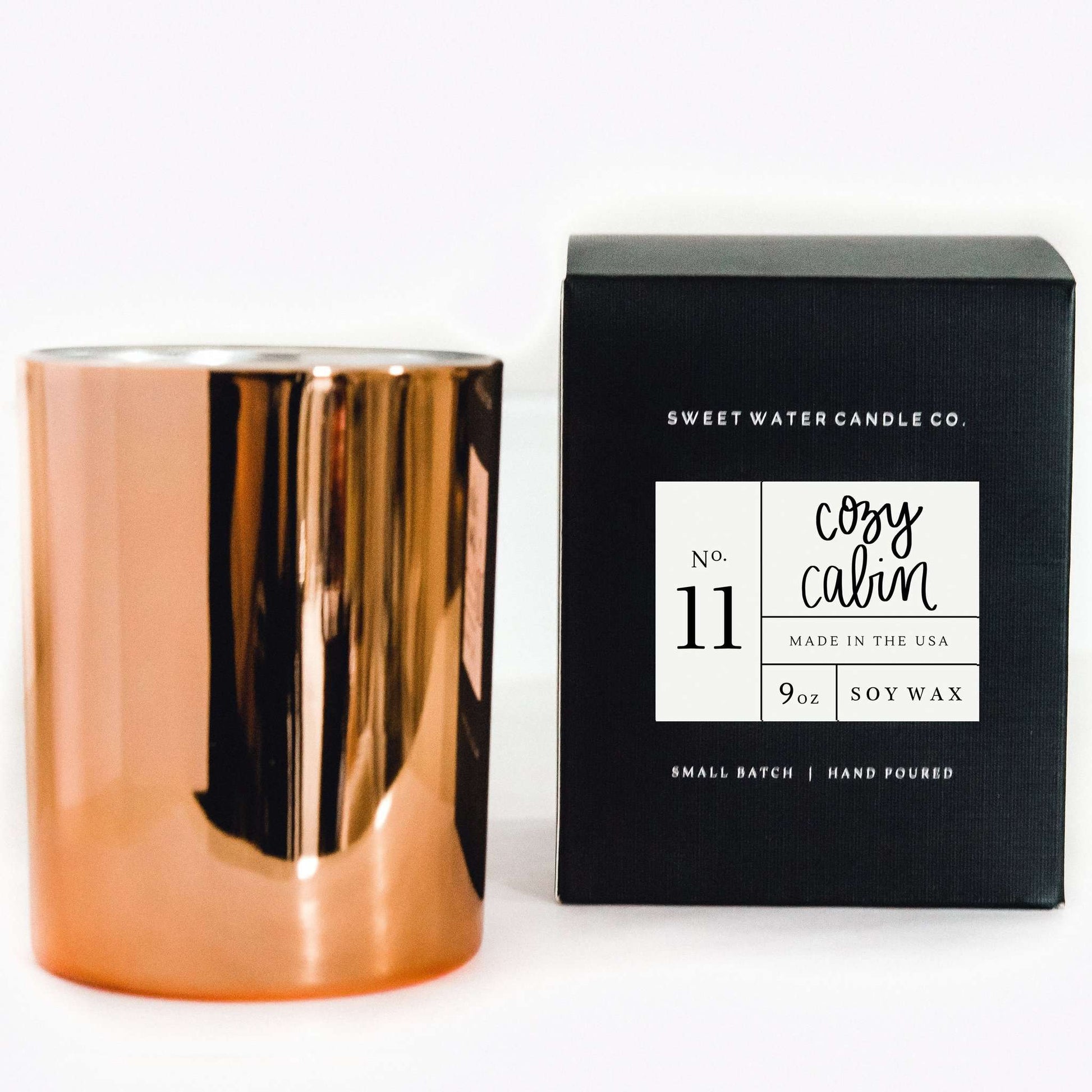 Cozy Cabin scented candle in a rose gold jar