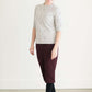 Woman wearing a gray crew neck sweatshirt that is half sleeves and has jewel designs on it.
