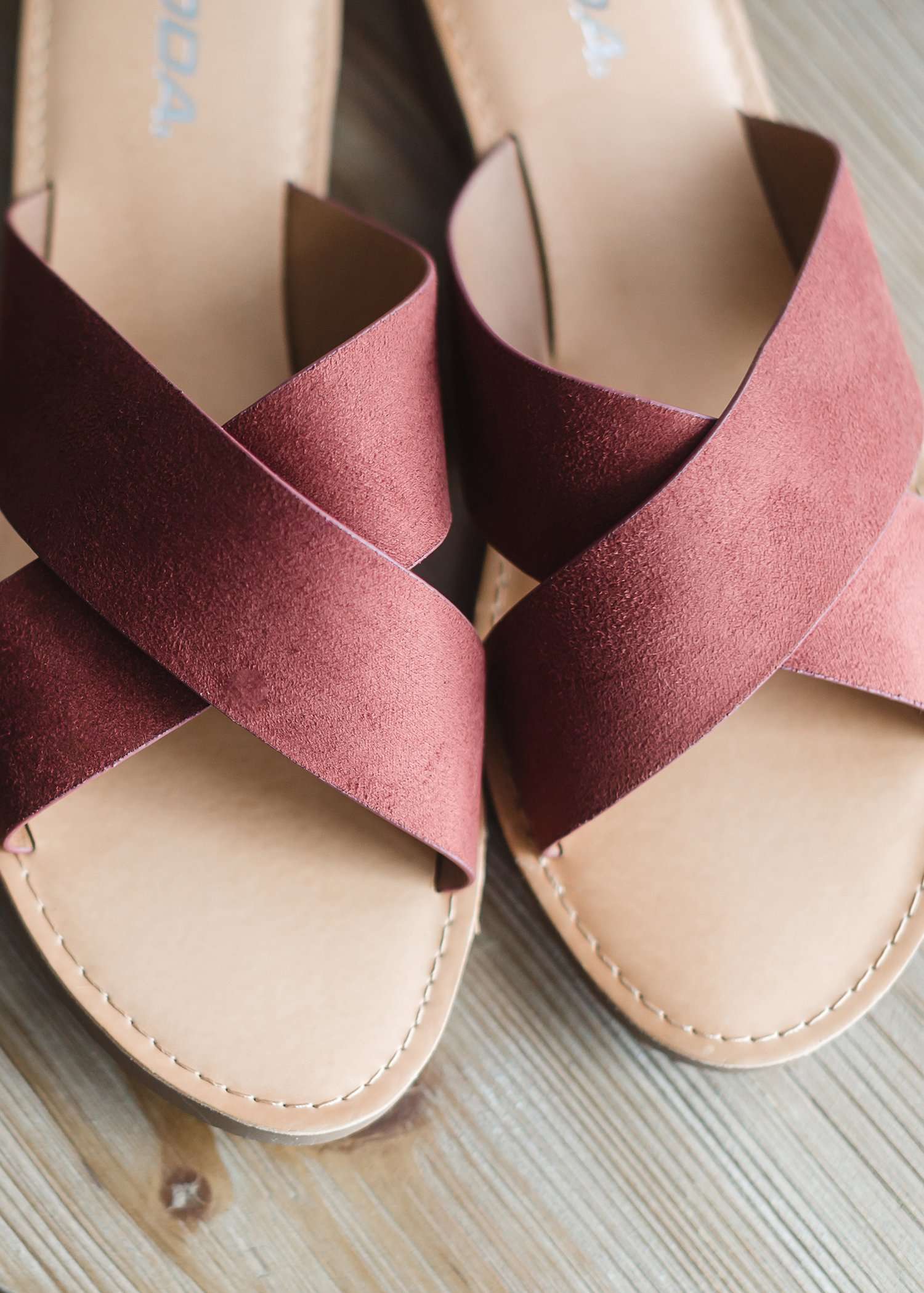 Slide on sandals with a criss cross top