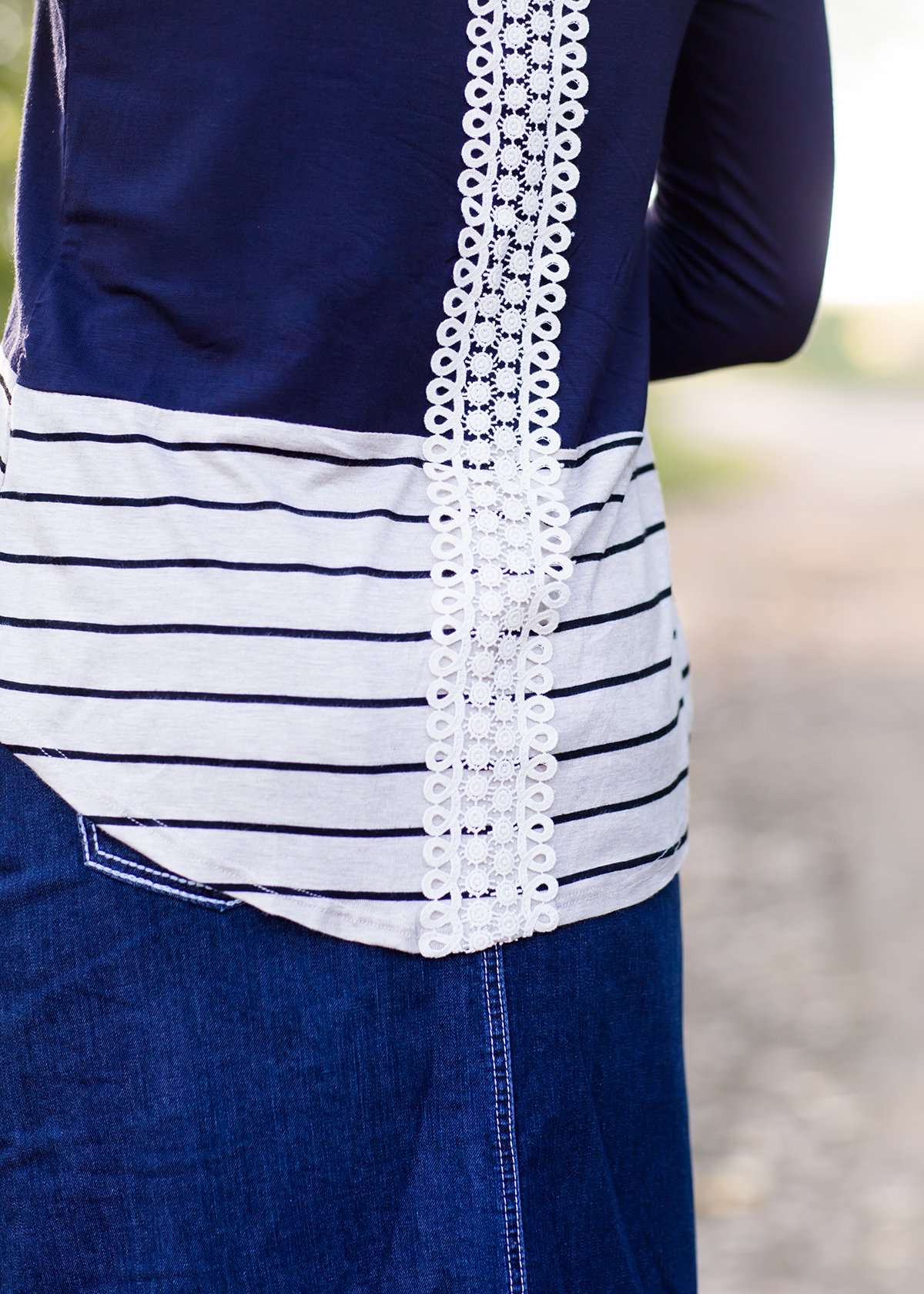 olive, navy and striped block long sleeve top with a back embroidered detail.