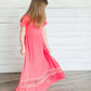 coral or mint colored short sleeve girls maxi dress with crochet detail at the bottom and elastic waist.