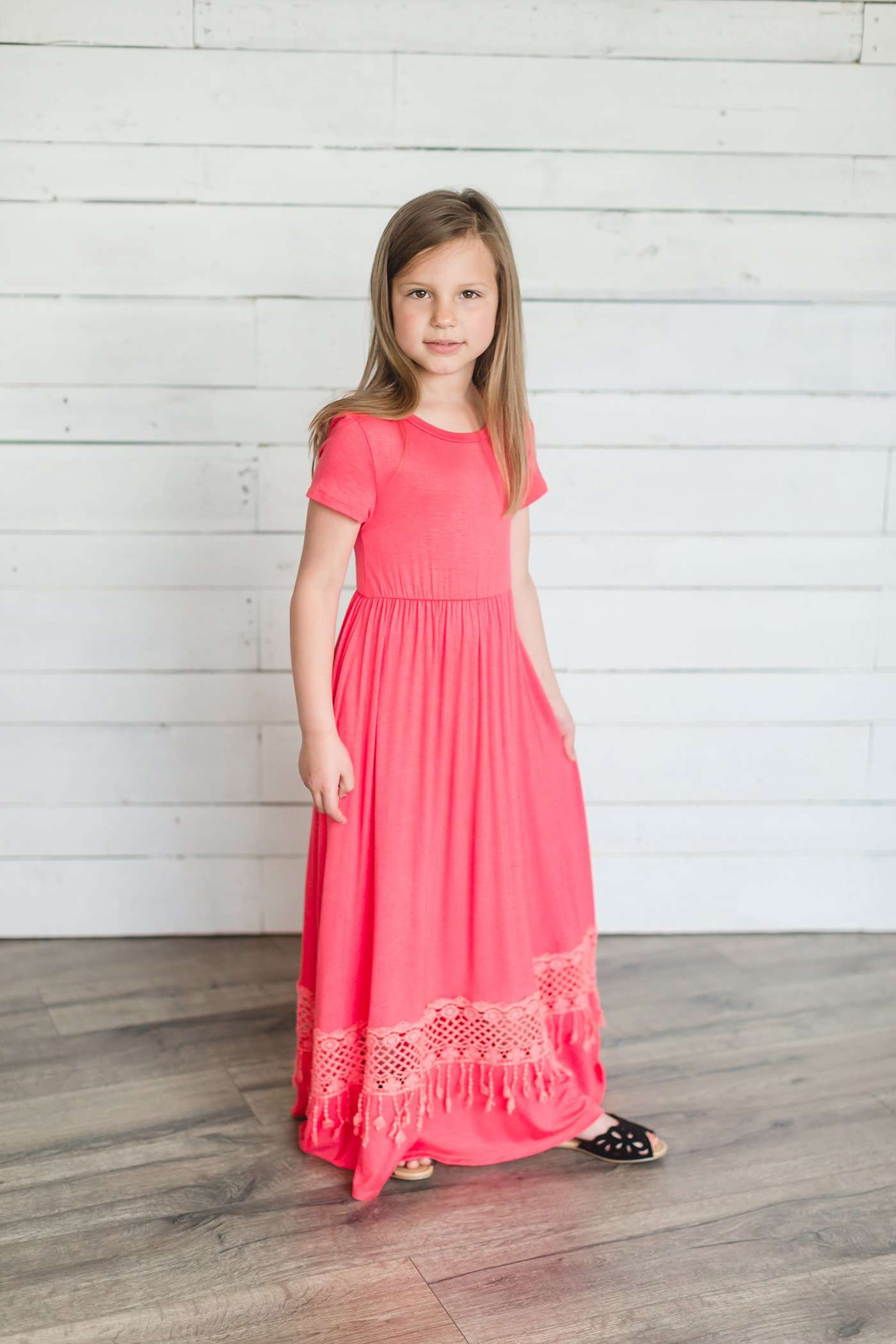 coral or mint colored short sleeve girls maxi dress with crochet detail at the bottom and elastic waist.