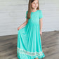 coral or mint colored short sleeve girls maxi dress with crochet detail at the bottom and elastic waist.