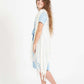 Woman wearing a cream fringed knit vest with a crochet look