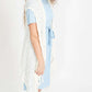 Woman wearing a cream fringed knit vest with a crochet look