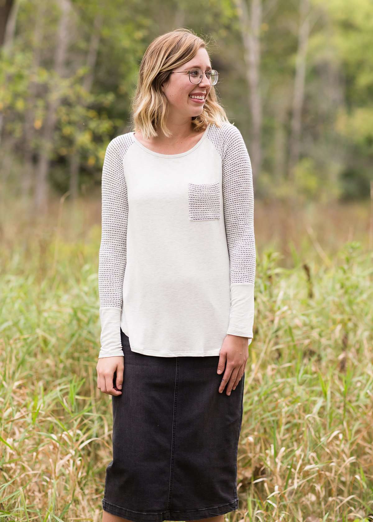 White top with grey contrast long sleeves and front pocket.