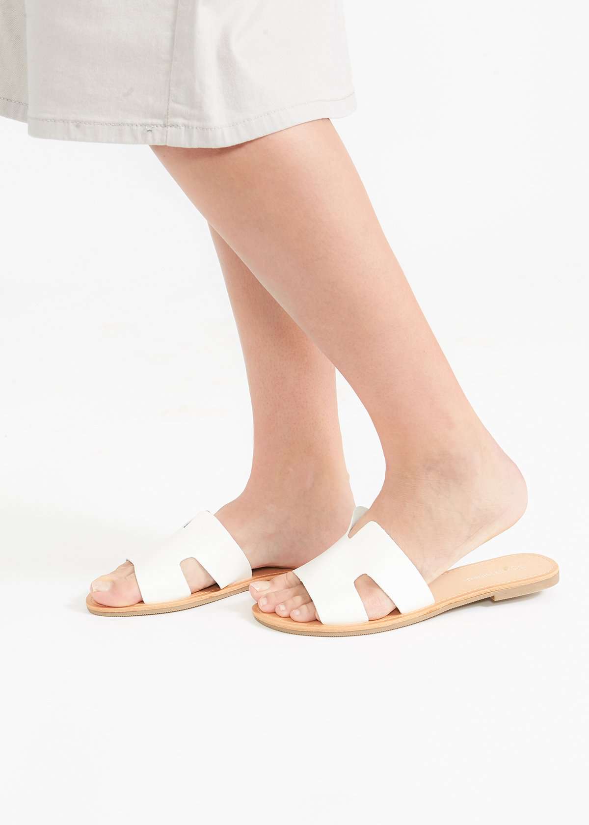 Slip on tan or white sandals