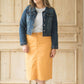 Dandelion colored denim skirt below the knee.