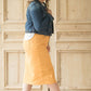 Dandelion colored denim skirt below the knee.