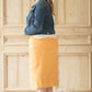 Dandelion colored denim skirt below the knee.