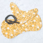 This is a mustard colored baby burp cloth, baby bandana and headband gift set.