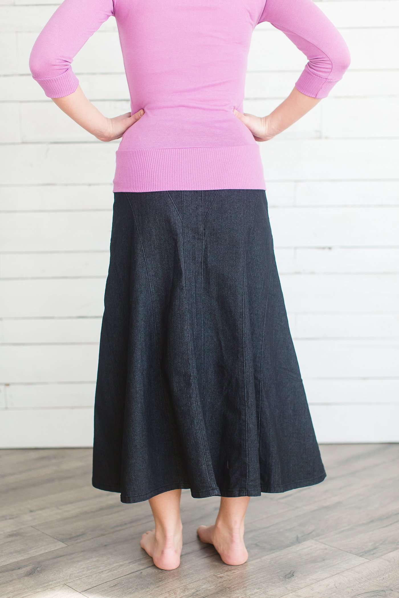 Ankle length flare black dye cotton side zip skirt.