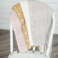 Women's button down detailed cardigan in mustard, dusty pink, ivory and gray.
