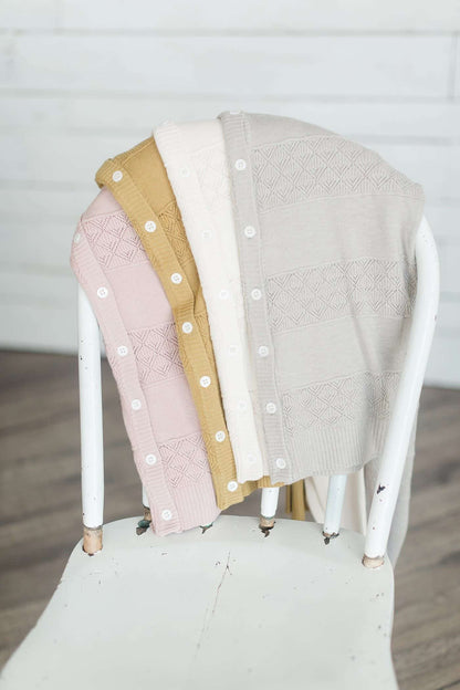 Women's button down detailed cardigan in mustard, dusty pink, ivory and gray.