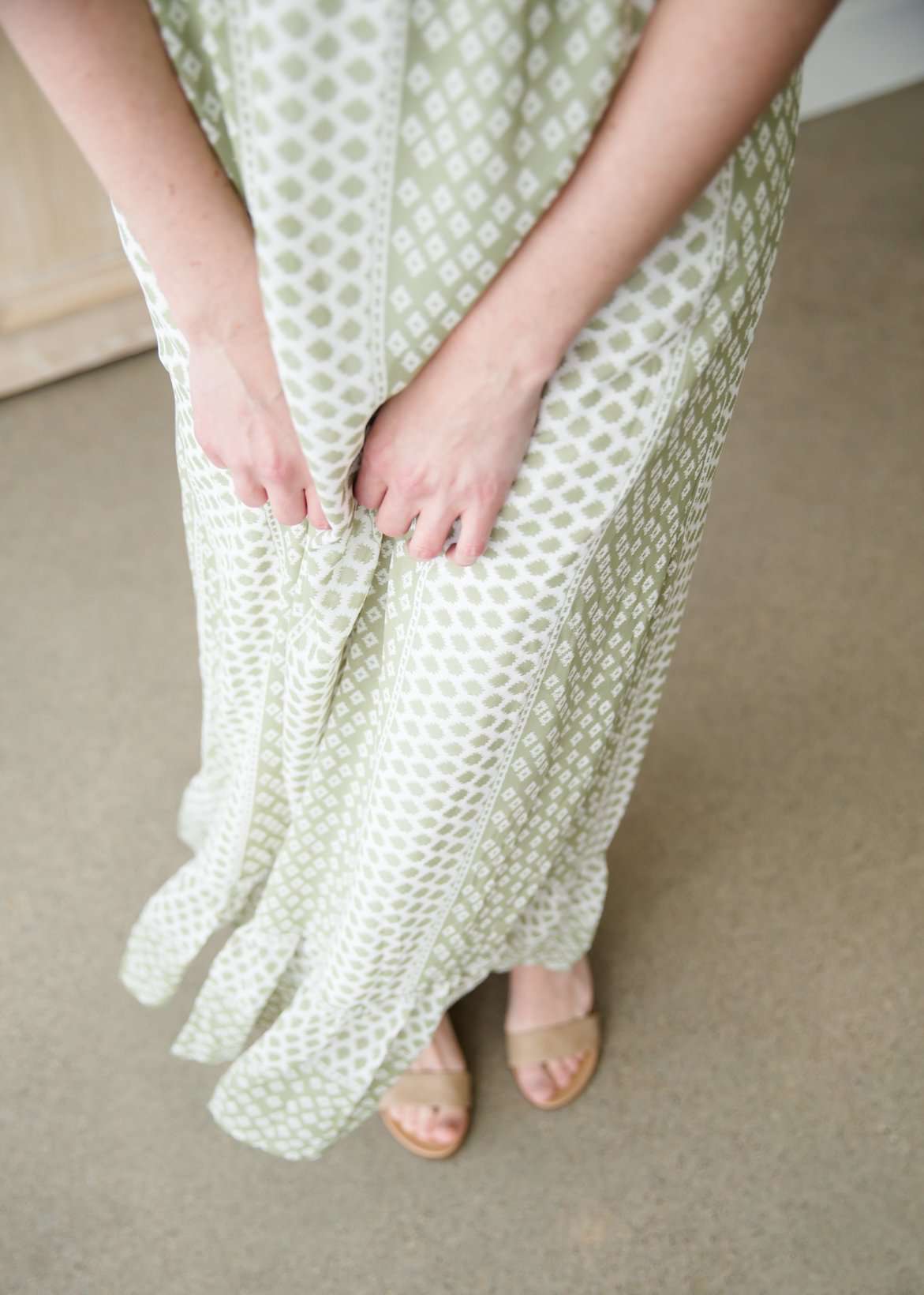 Green polka dot ditsy print maxi dress with flutter sleeves and faux button front