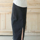 Woman wearing a modest long black denim skirt with pockets