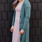 jade colored long double pocket button up cardigan