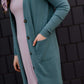 jade colored long double pocket button up cardigan