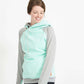 Woman wearing a mint and gray doublehood sweatshirt from ampersand avenue