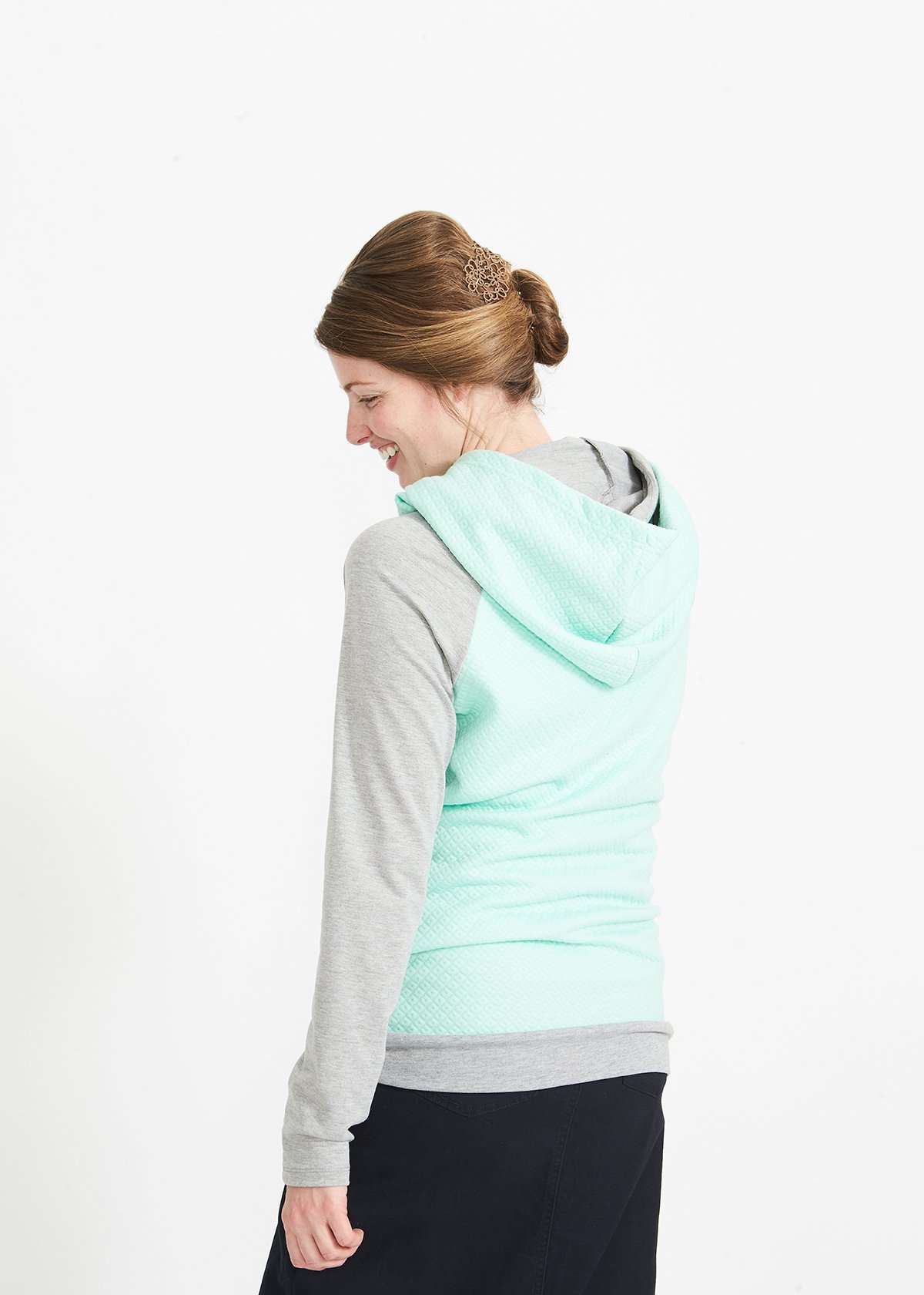 Woman wearing a mint and gray doublehood sweatshirt from ampersand avenue