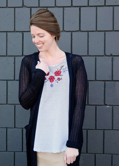 modest women wearing a black and white striped embroidered floral tank top