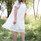 oatmeal colored flowy embroidered midi dress