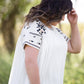 oatmeal colored flowy embroidered midi dress