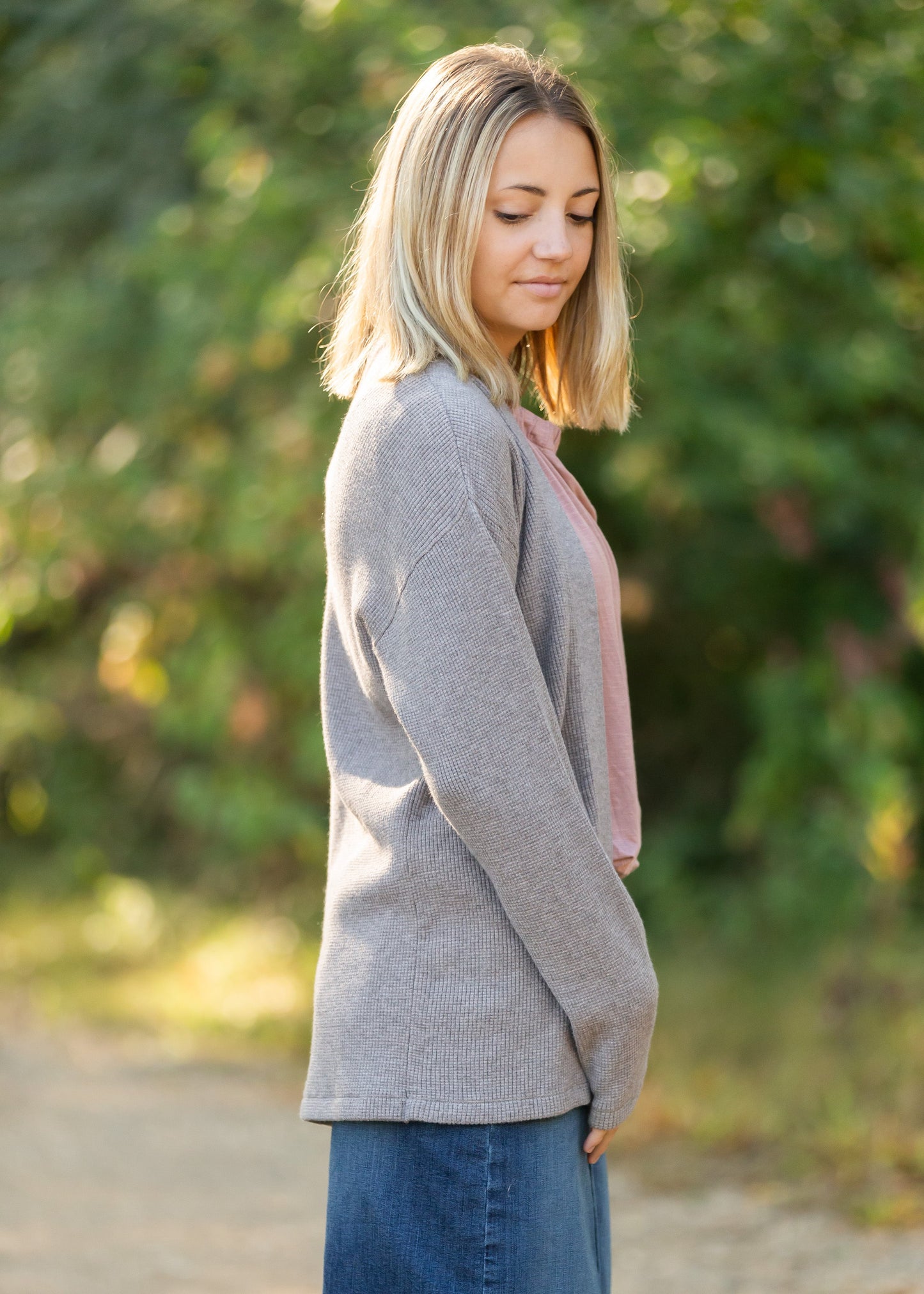 This high quality waffle knit cardigan hits right at the hip and is an elevated essential.