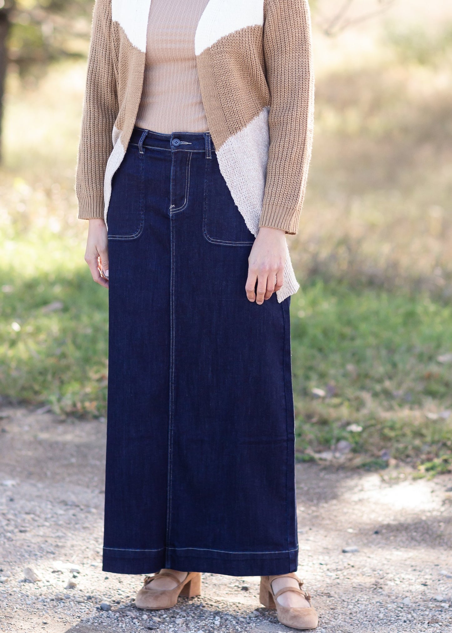 The Esther is a straight fit long denim skirt, with contrasting stitching with patch pockets.The Esther is a straight fit long denim skirt, with contrasting stitching with patch pockets.