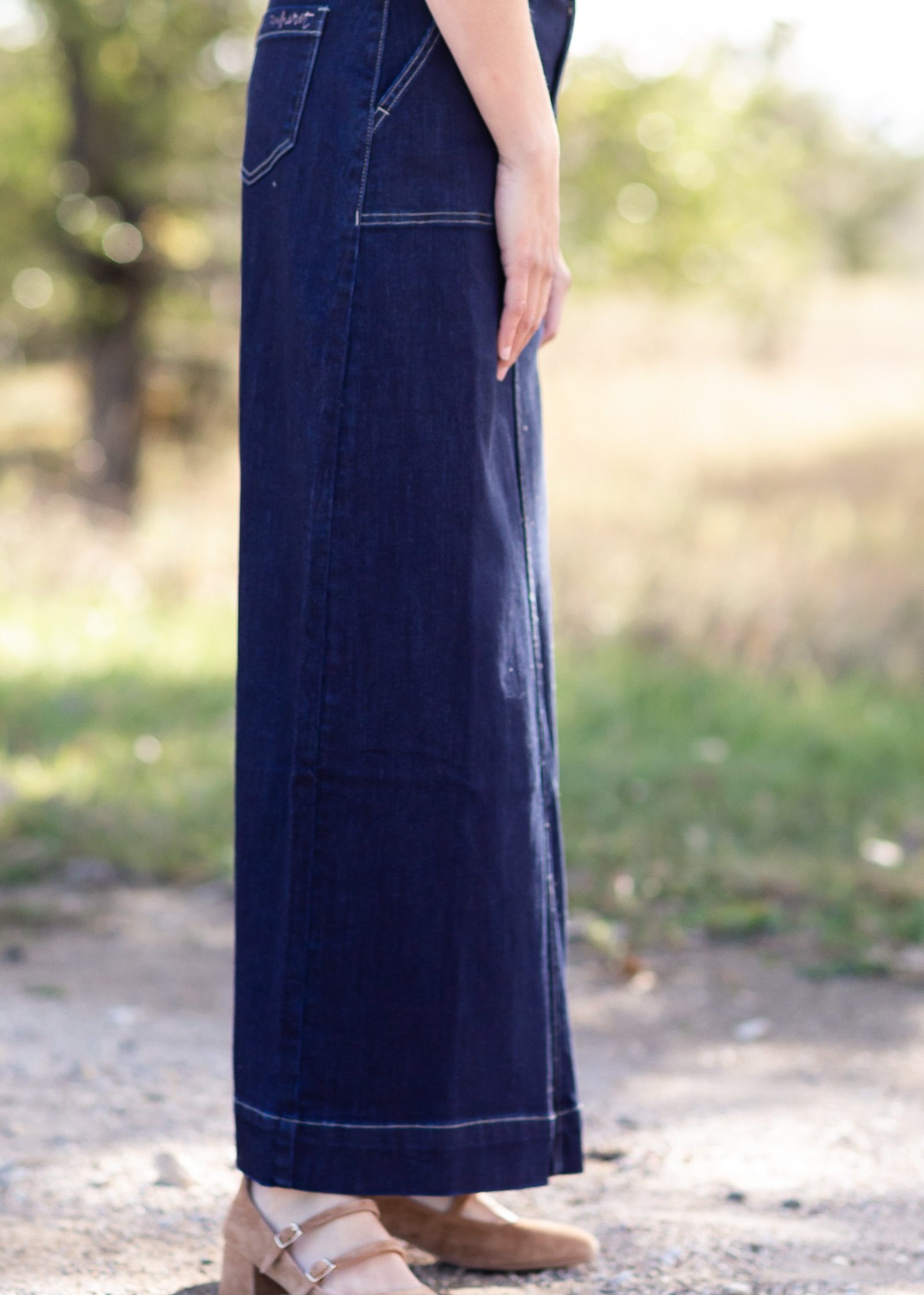 The Esther is a straight fit long denim skirt, with contrasting stitching with patch pockets.