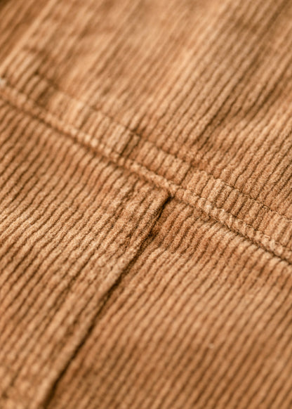The Farrah Rust Corduroy Skirt is an Inherit Exclusive that is made with a fine corduroy texture that is extra stretchy. This midi skirt features button details down the front of the skirt with three functioning buttons at the top. There are functioning patch-style pockets on the front and a raw hem detail that finishes off the skirt. This midi skirt is super stretchy so you will feel comfortable and on-trend without compromising!