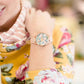 faux-leather band and Florida-esque floral design with a gold flamingo accent. 