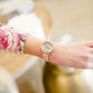 faux-leather band and Florida-esque floral design with a gold flamingo accent. 