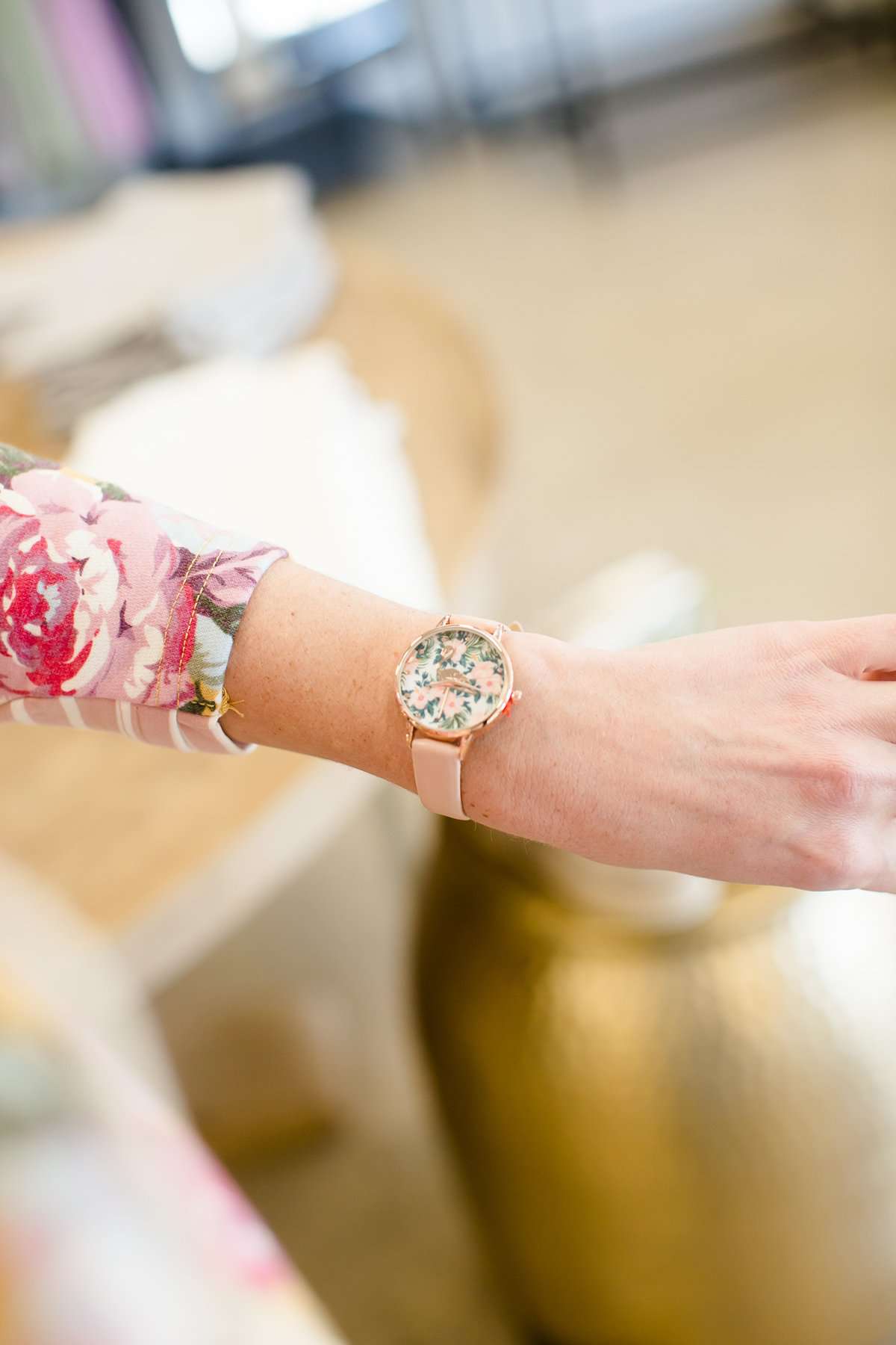 faux-leather band and Florida-esque floral design with a gold flamingo accent. 