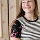 black white and pink floral sleeve and stripe front top