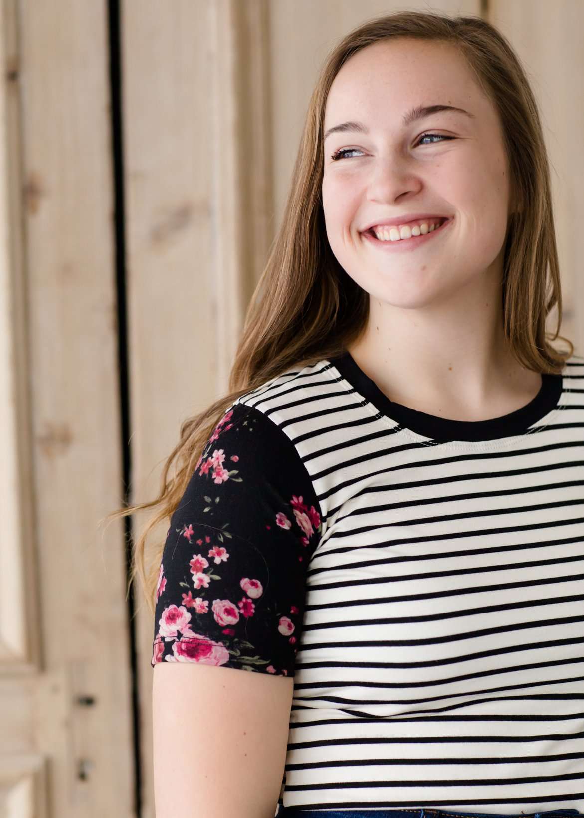black white and pink floral sleeve and stripe front top