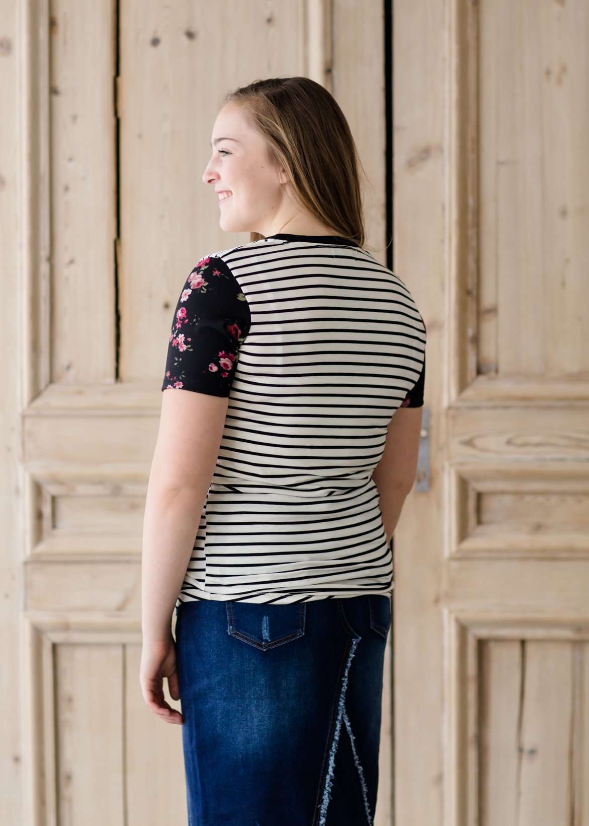 black white and pink floral sleeve and stripe front top