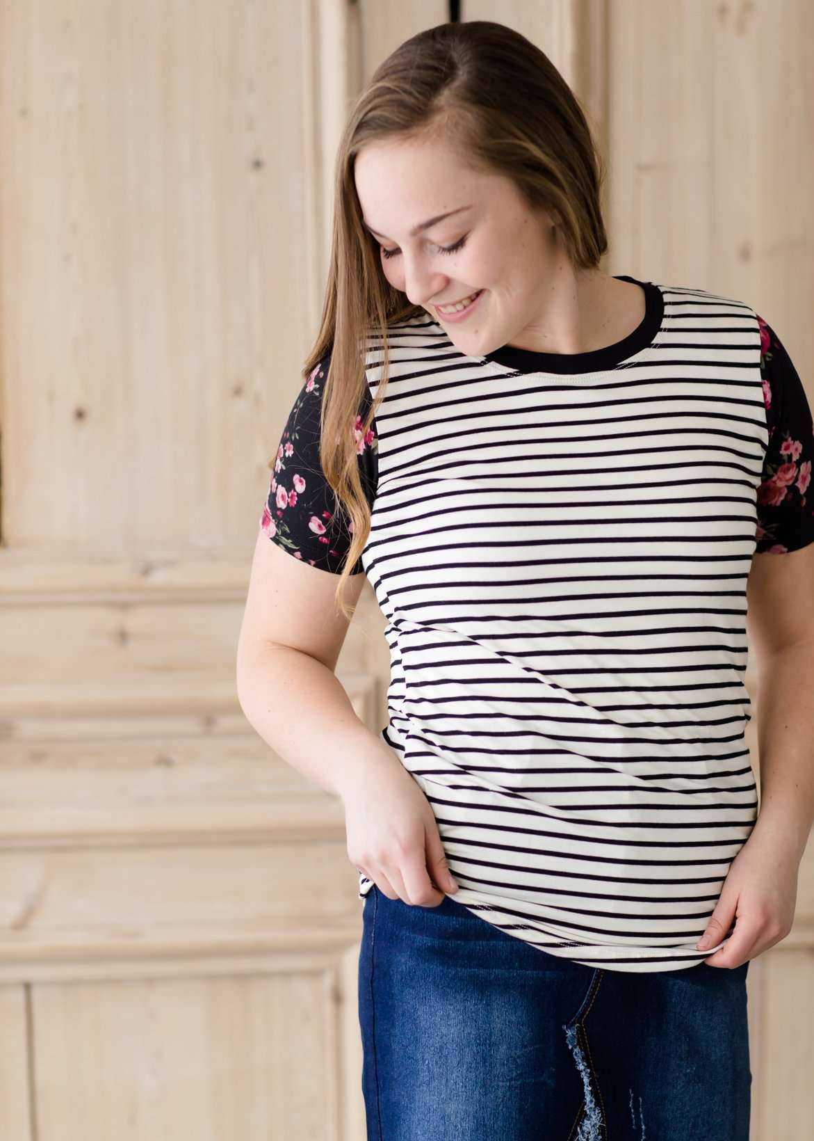 black white and pink floral sleeve and stripe front top