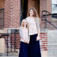Woman wearing a modest baseball tee with black striped arms and a blush floral body along with her daughter making it a mommy and me modest raglan style tee shirt