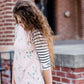 Woman wearing a modest baseball tee with black striped arms and a blush floral body along with her daughter making it a mommy and me modest raglan style tee shirt