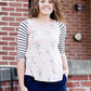 Woman wearing a modest baseball tee with black striped arms and a blush floral body along with her daughter making it a mommy and me modest raglan style tee shirt