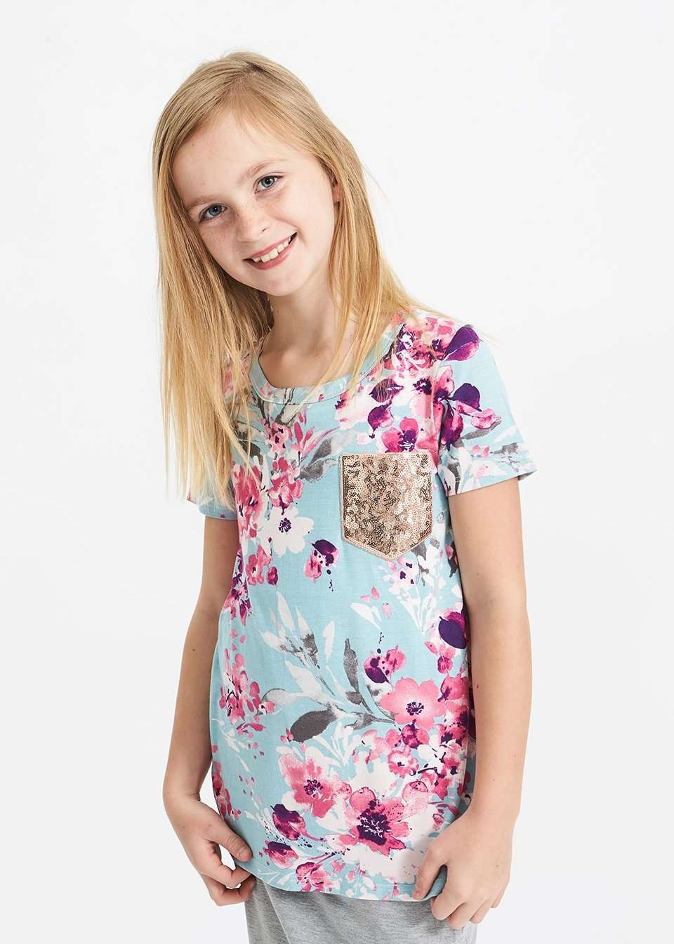 pink and purple florals on a blue girls tee shirt with a rose gold sequin pocket