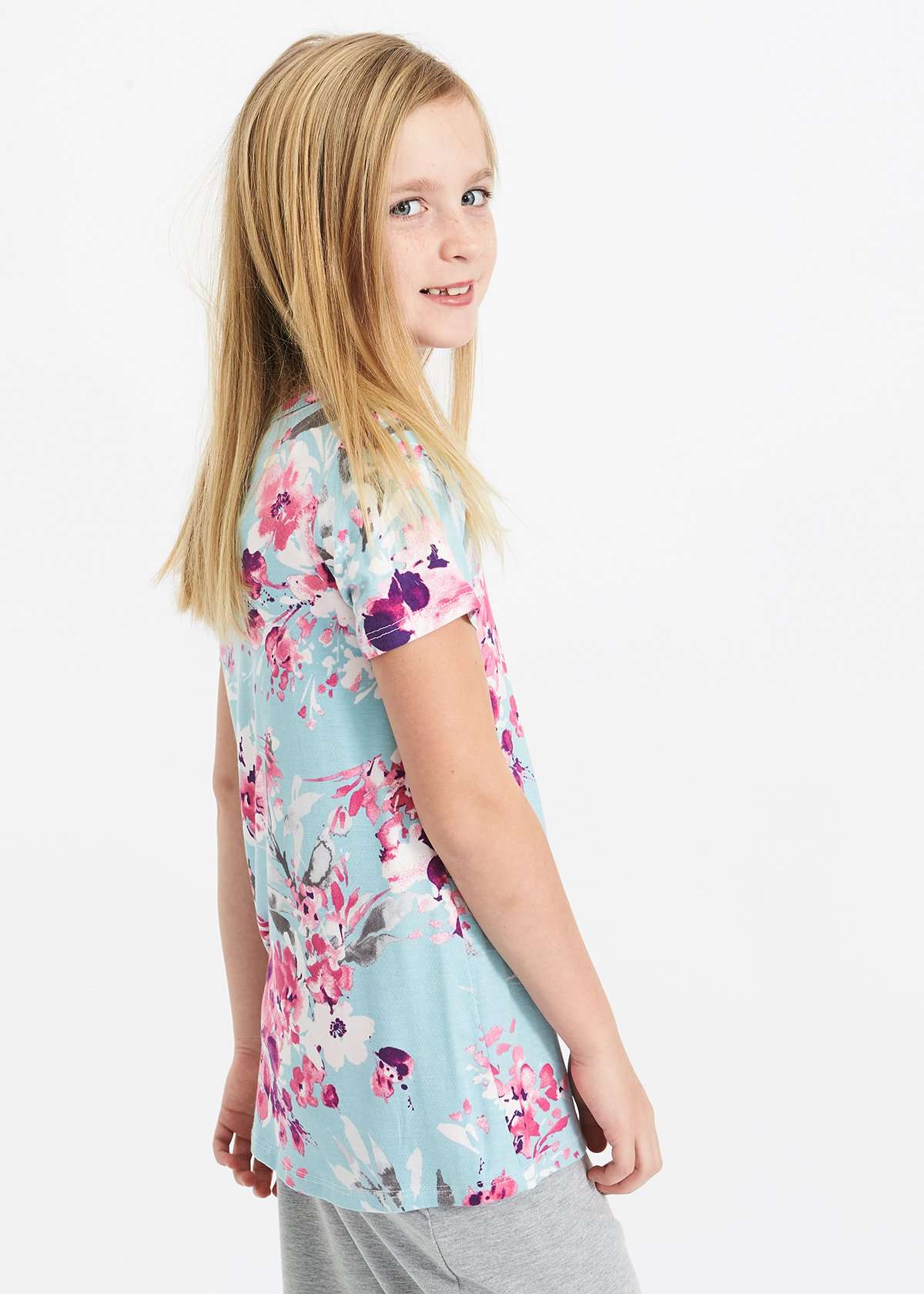 pink and purple florals on a blue girls tee shirt with a rose gold sequin pocket