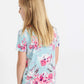 pink and purple florals on a blue girls tee shirt with a rose gold sequin pocket