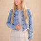 Frayed Light Wash Denim Jean Jacket with brass front buttons, a classic collar and a frayed hem.