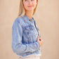 Frayed Light Wash Denim Jean Jacket with brass front buttons, a classic collar and a frayed hem.